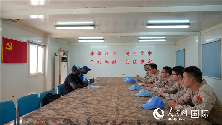 圖1 檢查組聽取工作匯報。王軍杰攝